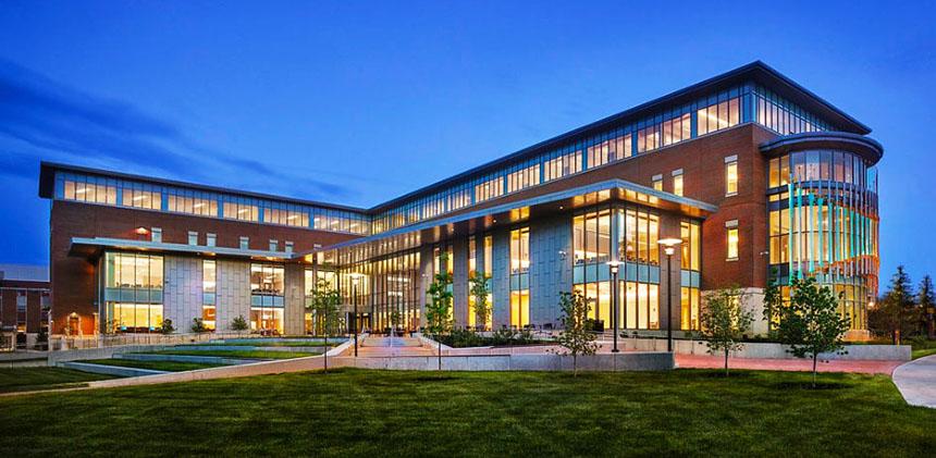 Business Hall at Rowan University, lit up at dusk